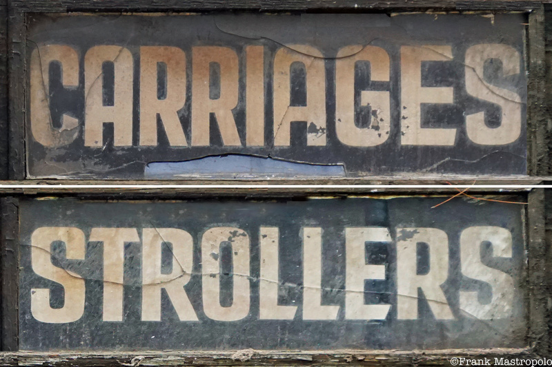A sign with a black background and white letters that says Carriages and Strollers