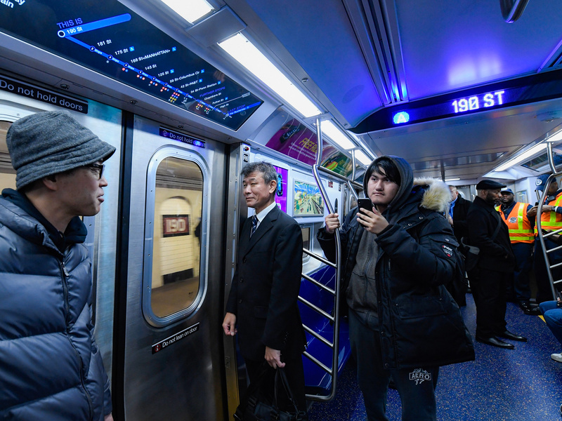 Passengers aboard the new subway cars