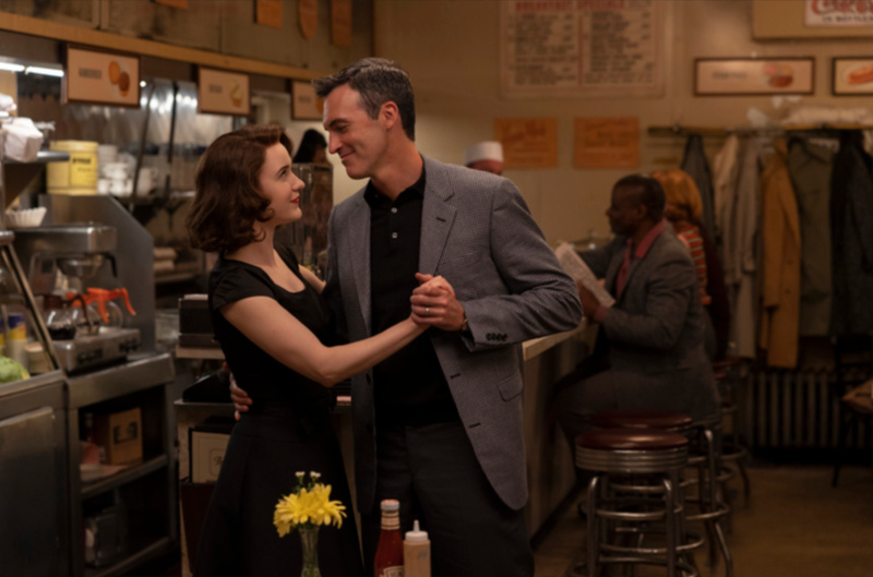 Midge Maisel and Gordon Ford dance inside the City Spoon diner