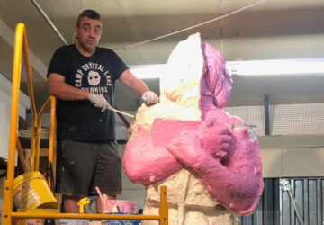 Joseph Reginella works on a large sculpture