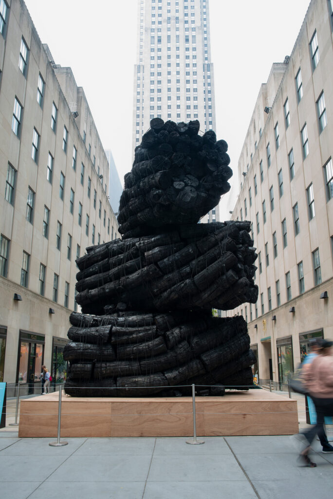 charcoal sculpture in Origin, Emergence, Return at Rockefeller Center