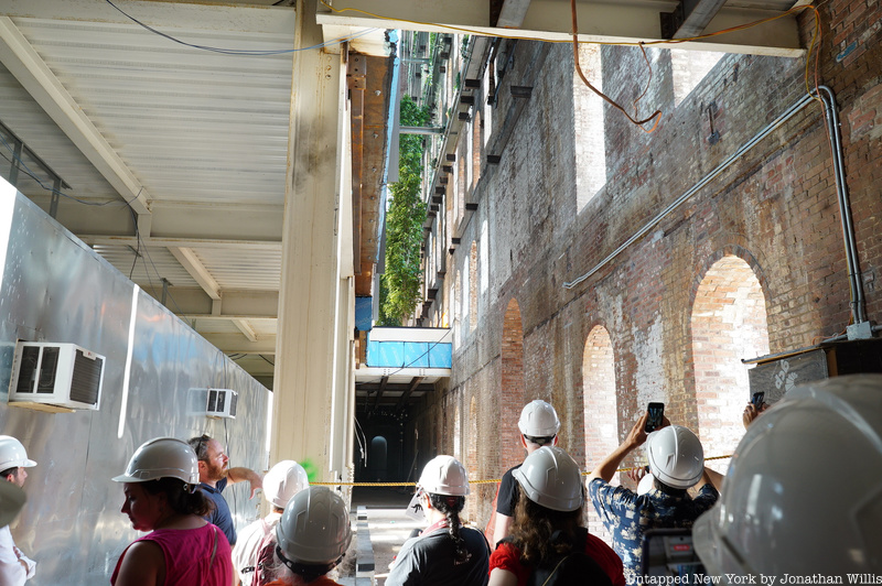 Insiders admiring the vertical garden while still under construction