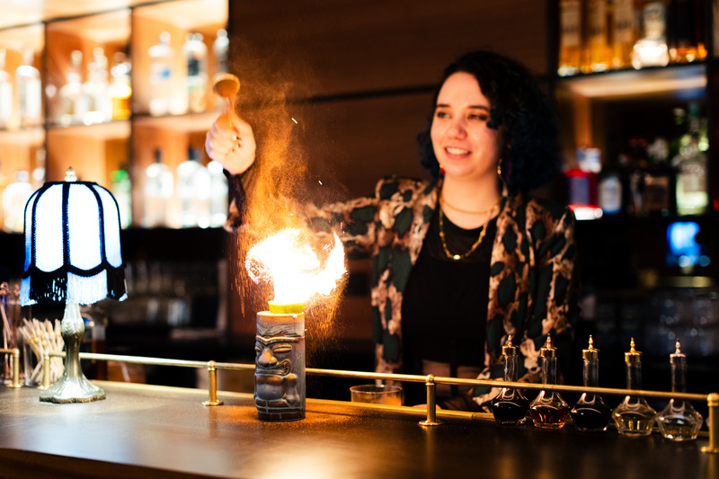 Bartender lights a drink on fire at Agency of Record