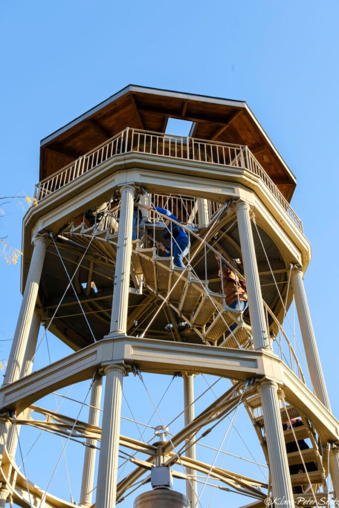 People walking up the stairs of the Mount Morris Fire Watchtower