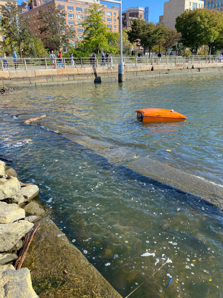 Orange WasteShark floats on the Hudson River