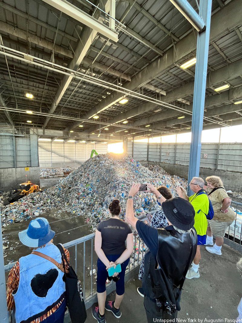 Inisders take photos of recycled materials piles