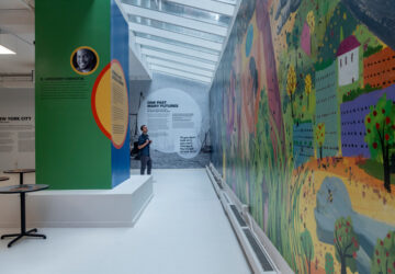Person viewing mural at Climate Museum