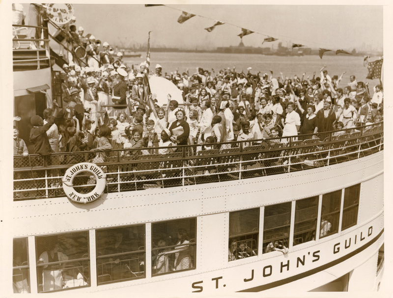 A crowd of people on the deck of The Floating Hospital