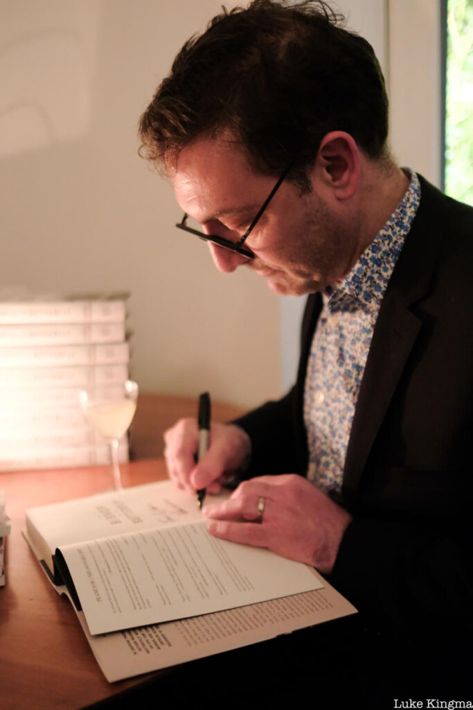 Michael Wolraich signign books at The Lit Salon