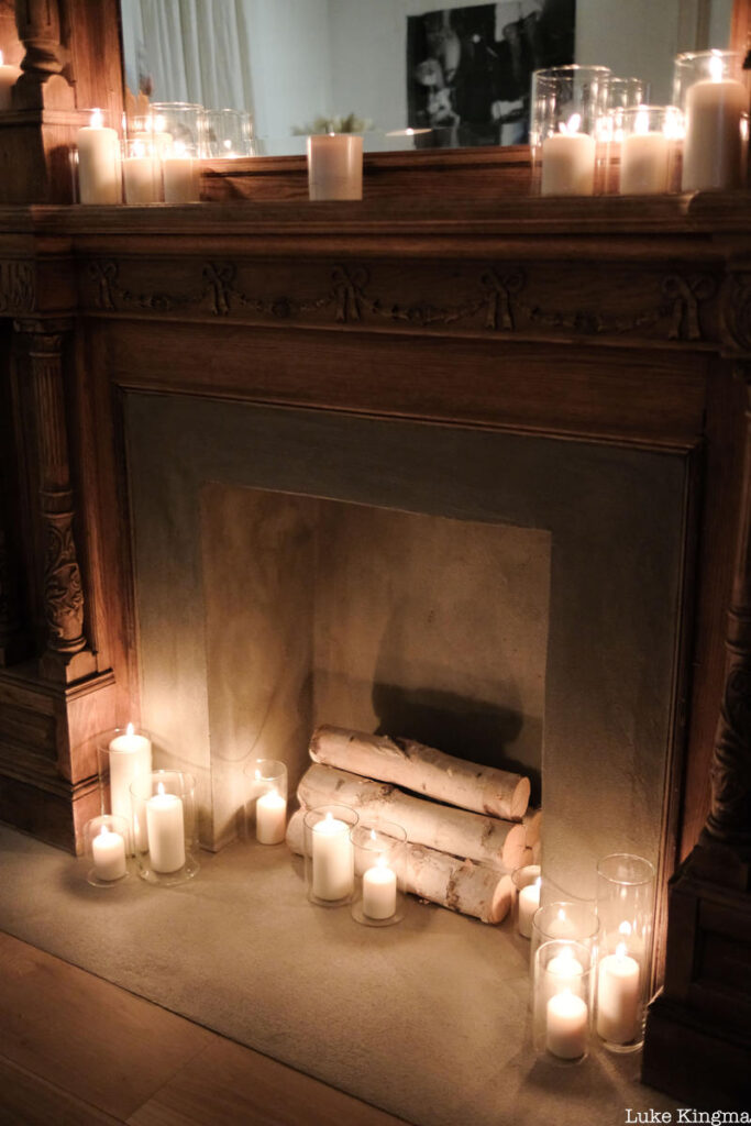 Candles and historic fireplace at at The Lit Salon
