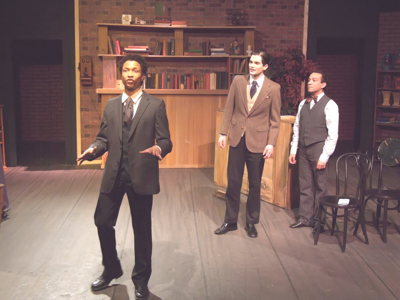 Three actors on a stage