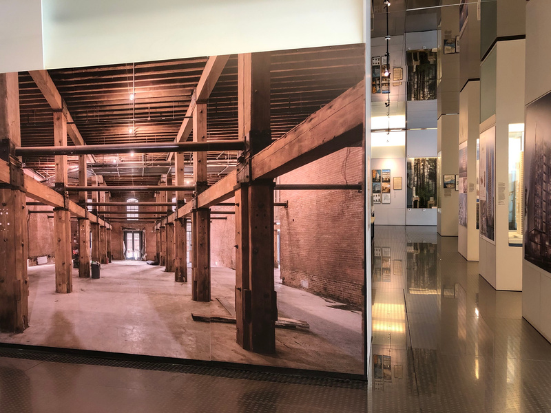 Large photo of wood support structure at Tall Timber exhibit inside the Skyscraper Museum