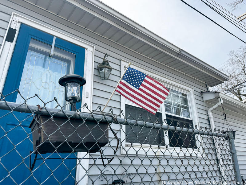 American flag in front of bungalow