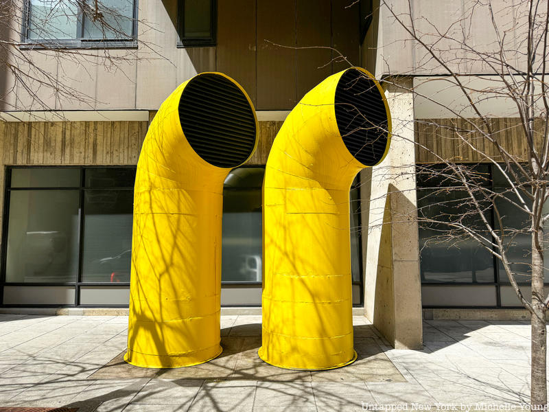 Pneumatic trash exhaust pipes in yellow on Roosevelt Island