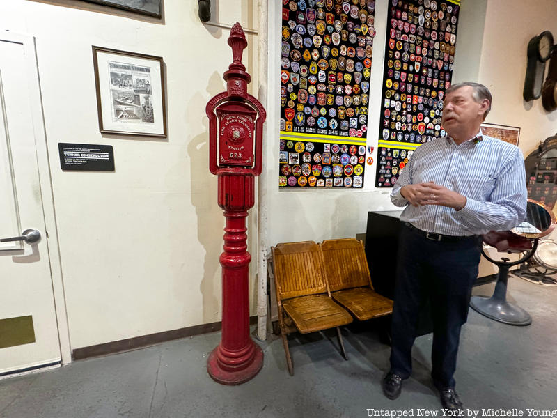 Gary Urbanowitz in front of oldest fire alarm call box in the NYC Fire Museum