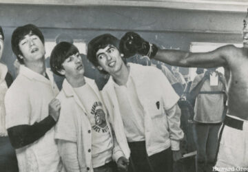 Muhammad Ali playfully pretends to punch The Beatles